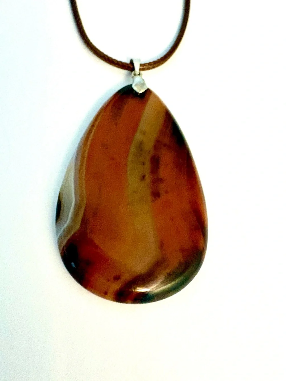 Beautiful, Geode Agate, pendant on a brown leather cord.